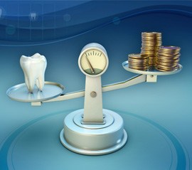 Tooth and coins on balance scale