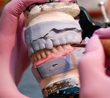 A  lab worker creating dentures