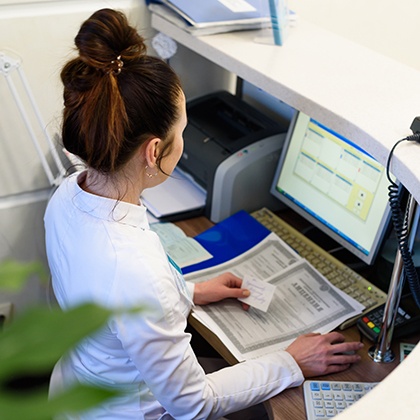 Receptionist at a computer