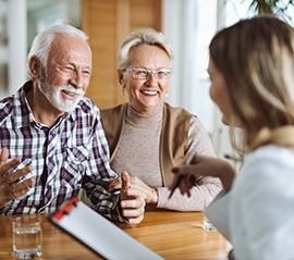 Couple speaking to a receptionist