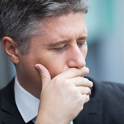 Man covering his mouth