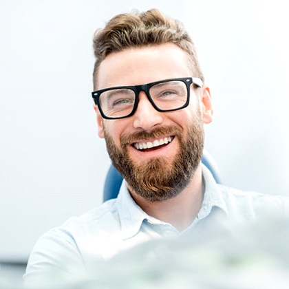 Man smiling after receiving CEREC Crowns in Fargo