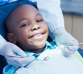 Smiling little boy in dental chair