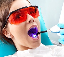 Woman receiving dental sealants