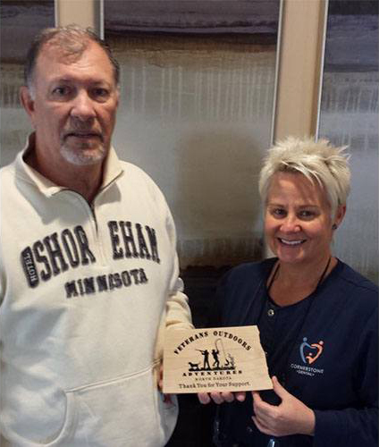 Dentist presenting plaque to patient