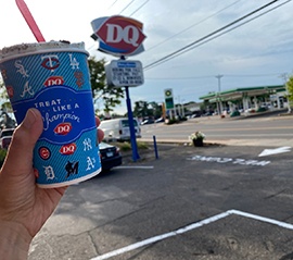person holding dairy queen blizzard