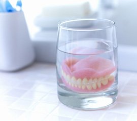 Dentures in Fargo soaking in solution