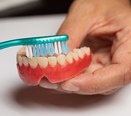Patients must be willing to commit to their oral health to qualify for dentures