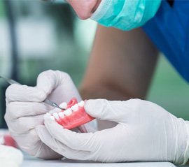 A dentist making dentures