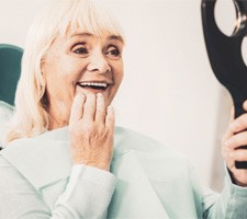 woman adjusting to her dentures