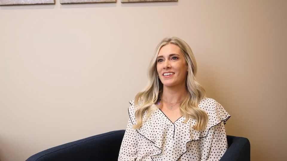 Fargo dentist wearing a face mask and dental binoculars while treating a patient