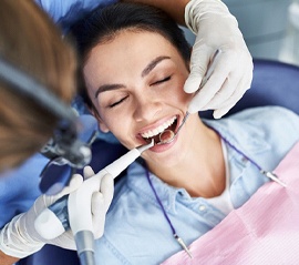 a patient undergoing routine dental implant care in Fargo