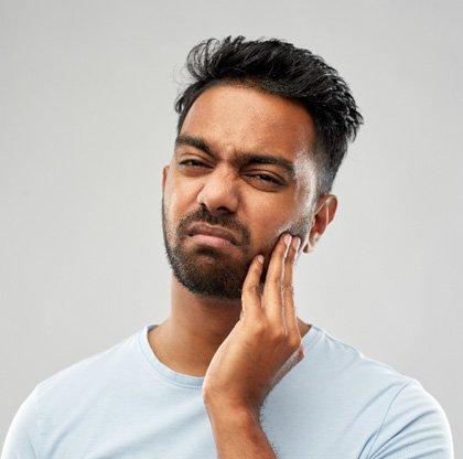 a man in Fargo experiencing a failed dental implant 