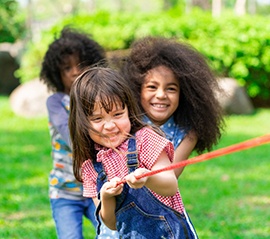 children playing tug-of-war