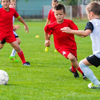 Boys playing soccer with mouthguards in Fargo