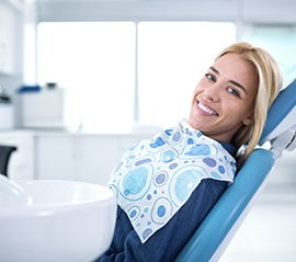 Smiling woman sitting in dental office