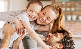 Mother father and child smiling together