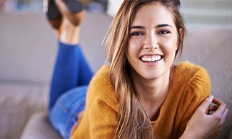 Smiling woman on couch