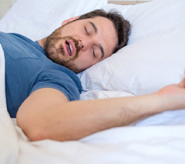 Snoring man in need of sleep apnea therapy in Fargo