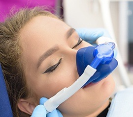 Woman with nitrous oxide nose mask