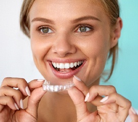 Patient smiling while using take-home teeth whitening in Fargo