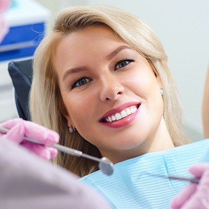 Smiling woman in dental chair