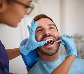 Man receiving dental exam