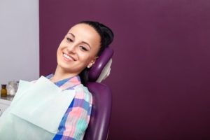Woman smiling during visit to dentist in Fargo