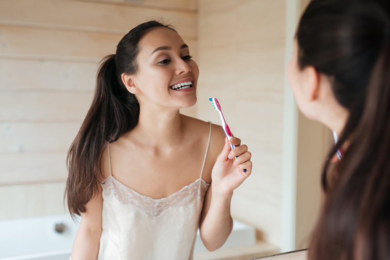 Woman brushing her teeth