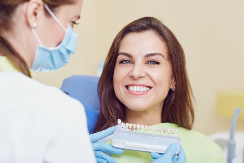 patient smiling after getting dental crown in Fargo