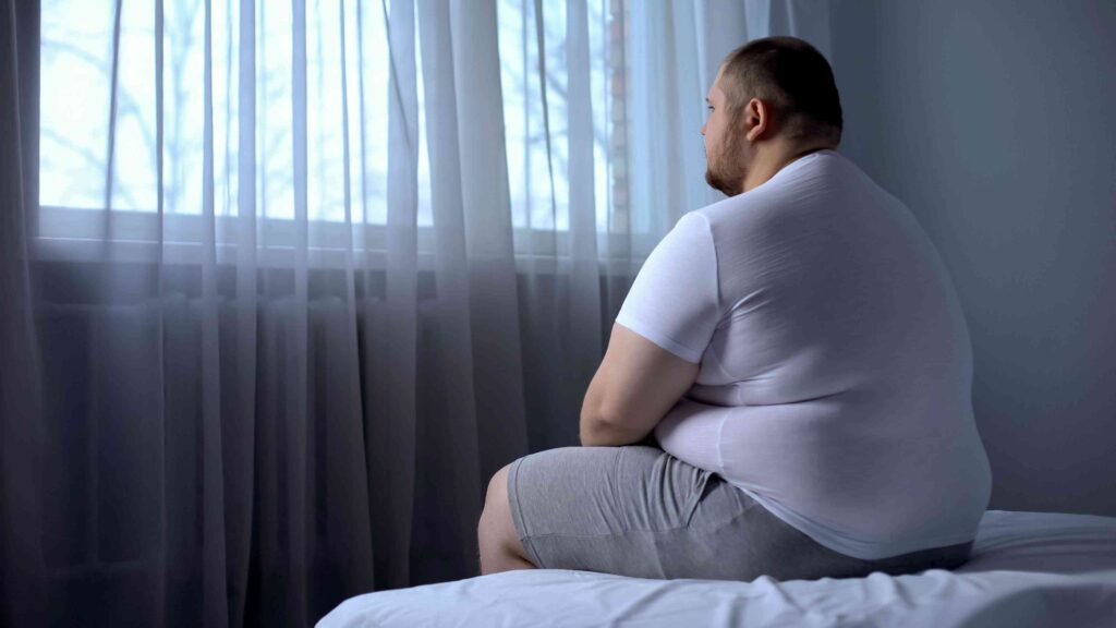 Man sitting in bed