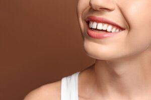 Person smiling with front-tooth gap.
